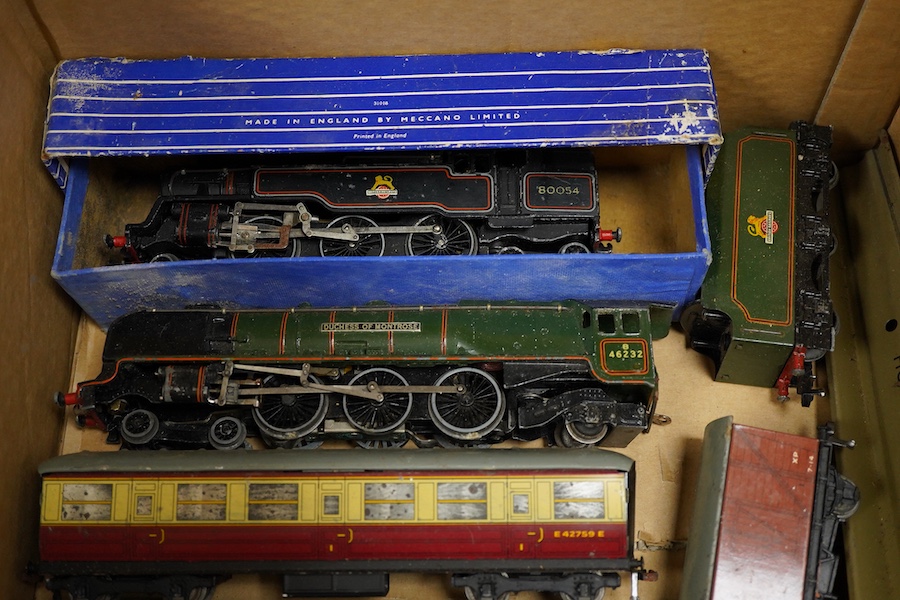 A collection of Hornby Dublo for 3-rail running, including two locomotives; a BR Duchess of Montrose, and a BR Standard Class 4MT 2-6-4T, together with four carmine and cream bogie coaches, nine freight wagons, a signal